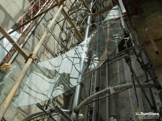 نصب شیشه‌های نمای سالن فردوسی نمایشگاه مشهد- آلومینیوم شیشه تهران